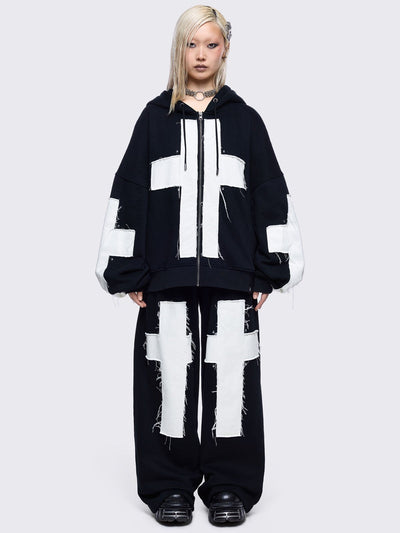 Black sweatpants with white chunky cross patches