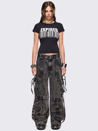 Grey acid washed multi pocket cargo jeans featuring a detachable-leg with zipper and all over strap, D-ring and lace up details.