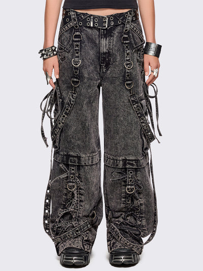 Grey acid washed multi pocket cargo jeans featuring a detachable-leg with zipper and all over strap, D-ring and lace up details.