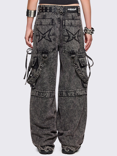 Grey acid washed multi pocket cargo jeans featuring a detachable-leg with zipper and all over strap, D-ring and lace up details.