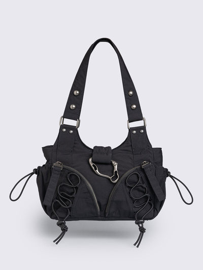 Black nylon multi pocket shoulder bag with metal hardware and lace up toggle details.