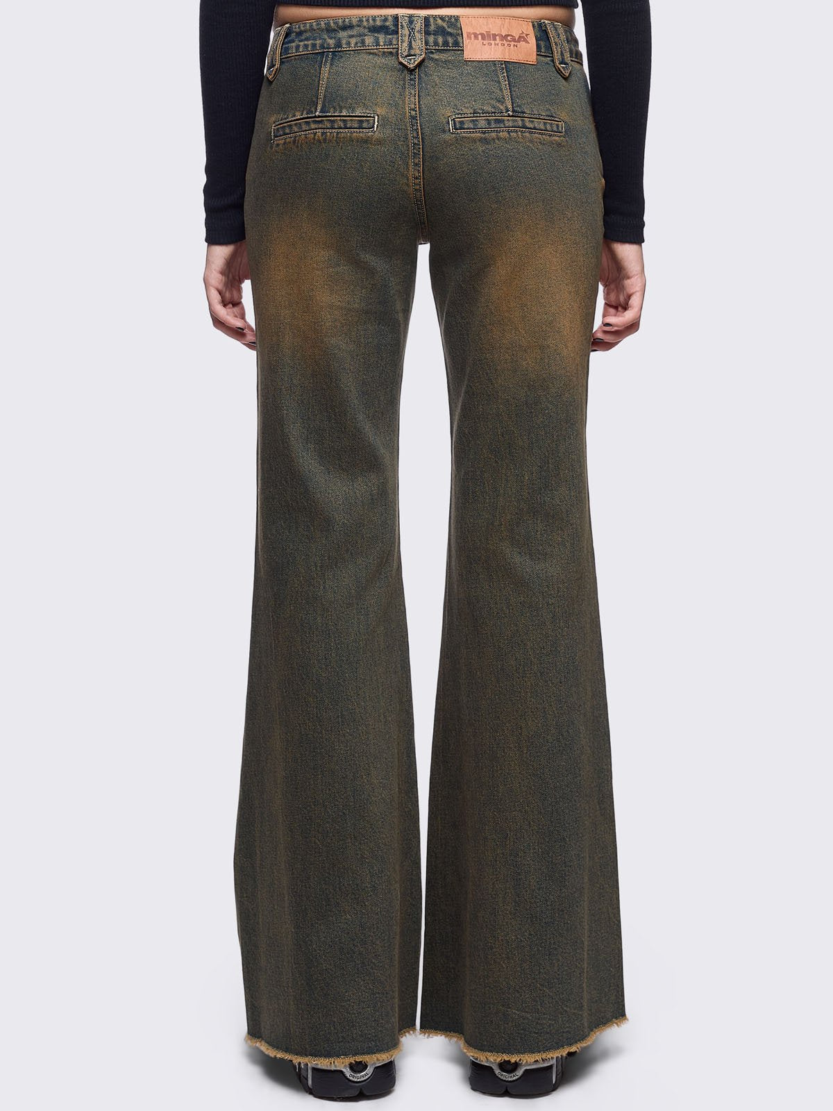 Blue washed flare jeans with honey overdye and front shedded