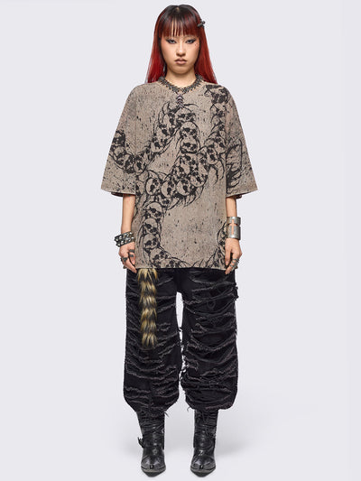 Beige oversize washed t-shirt featuring a skull centipede graphic front print.