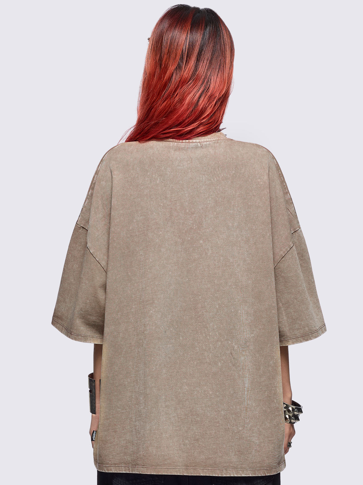 Beige oversize washed t-shirt featuring a skull centipede graphic front print.