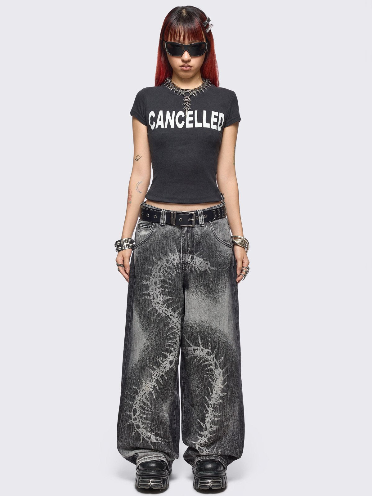 Grey washed baggy jeans with centipede graphic front print. 