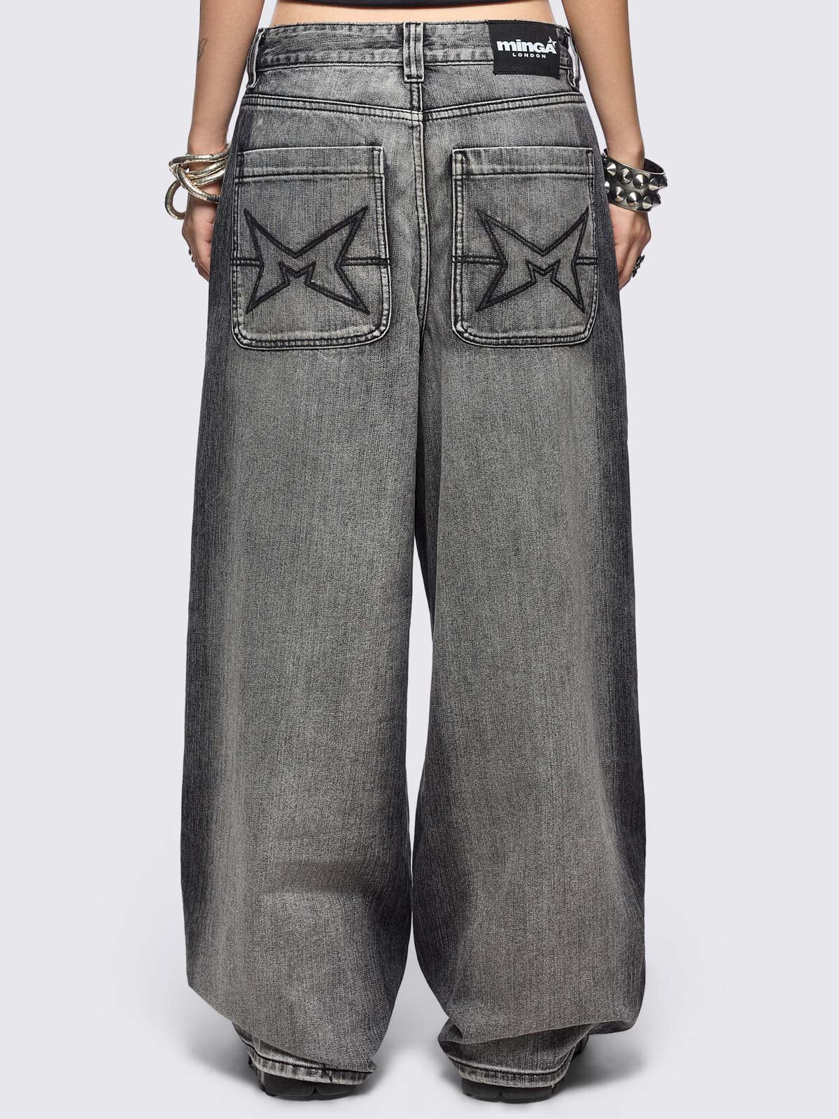 Grey washed baggy jeans with centipede graphic front print. 