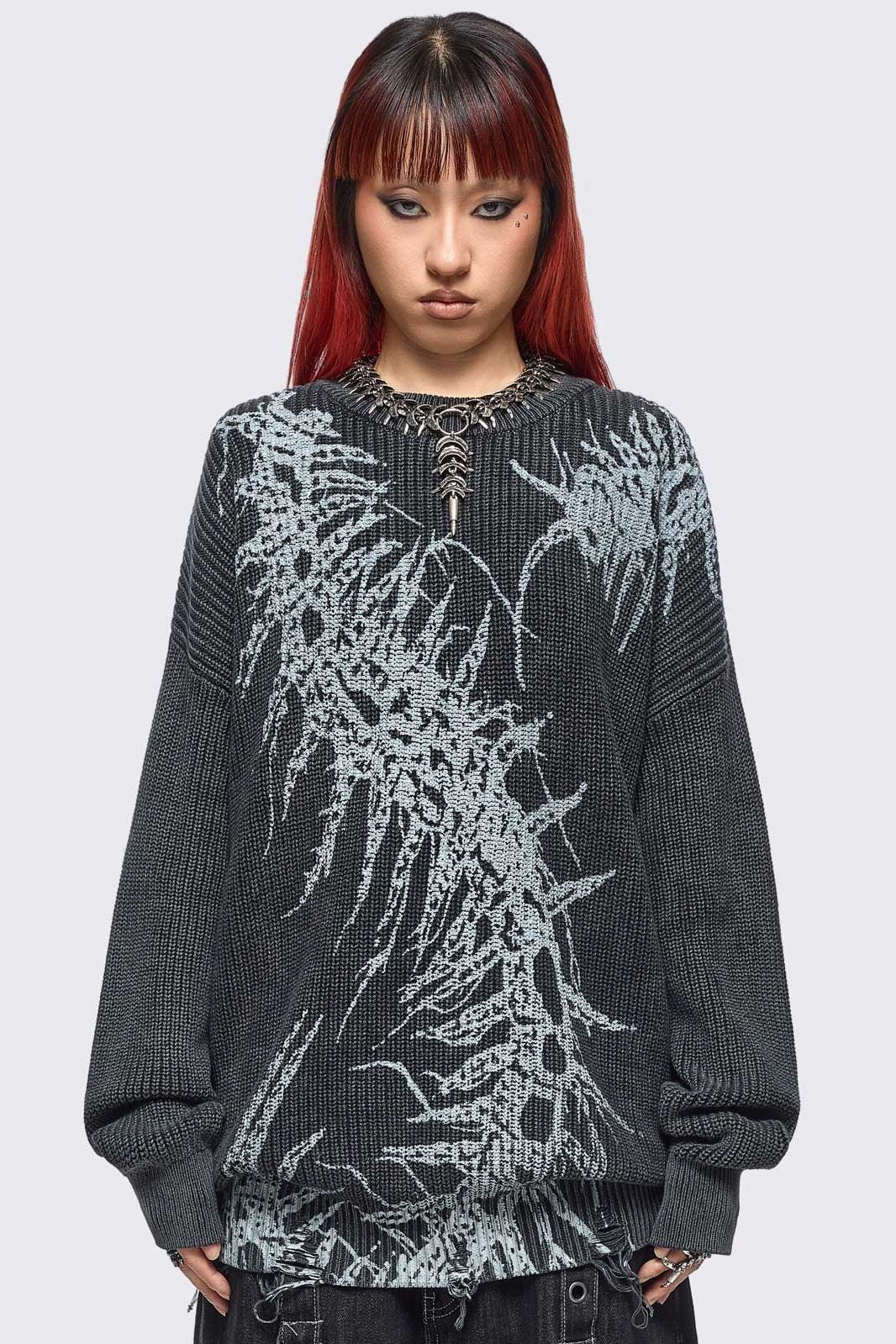Black washed knit jumper in chunky ribbed knit with centipede graphic front print and distressed hem details. 