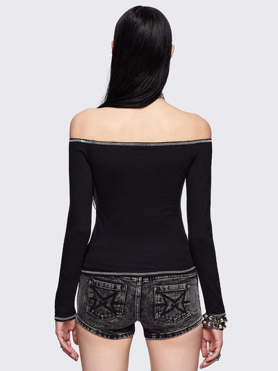 Black off-shoulder top with "Chaotic Angel" cross front print and white contrast stitches.