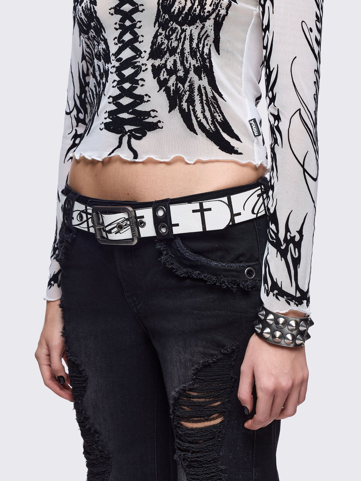 White vegan leather belt featuring "Chaotic angel" and crosses print.