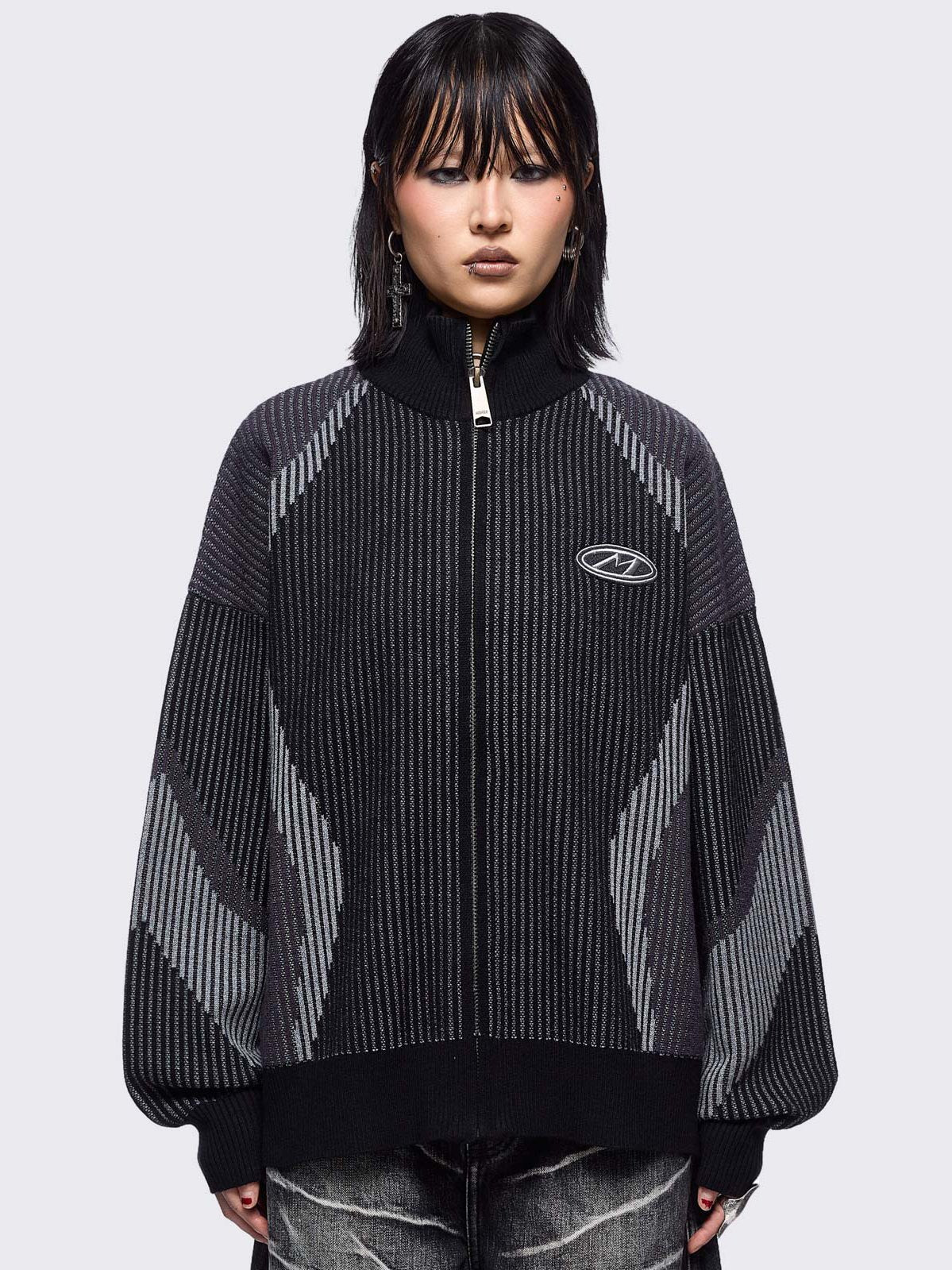 Black and grey color block knitted zip-up cardigan.