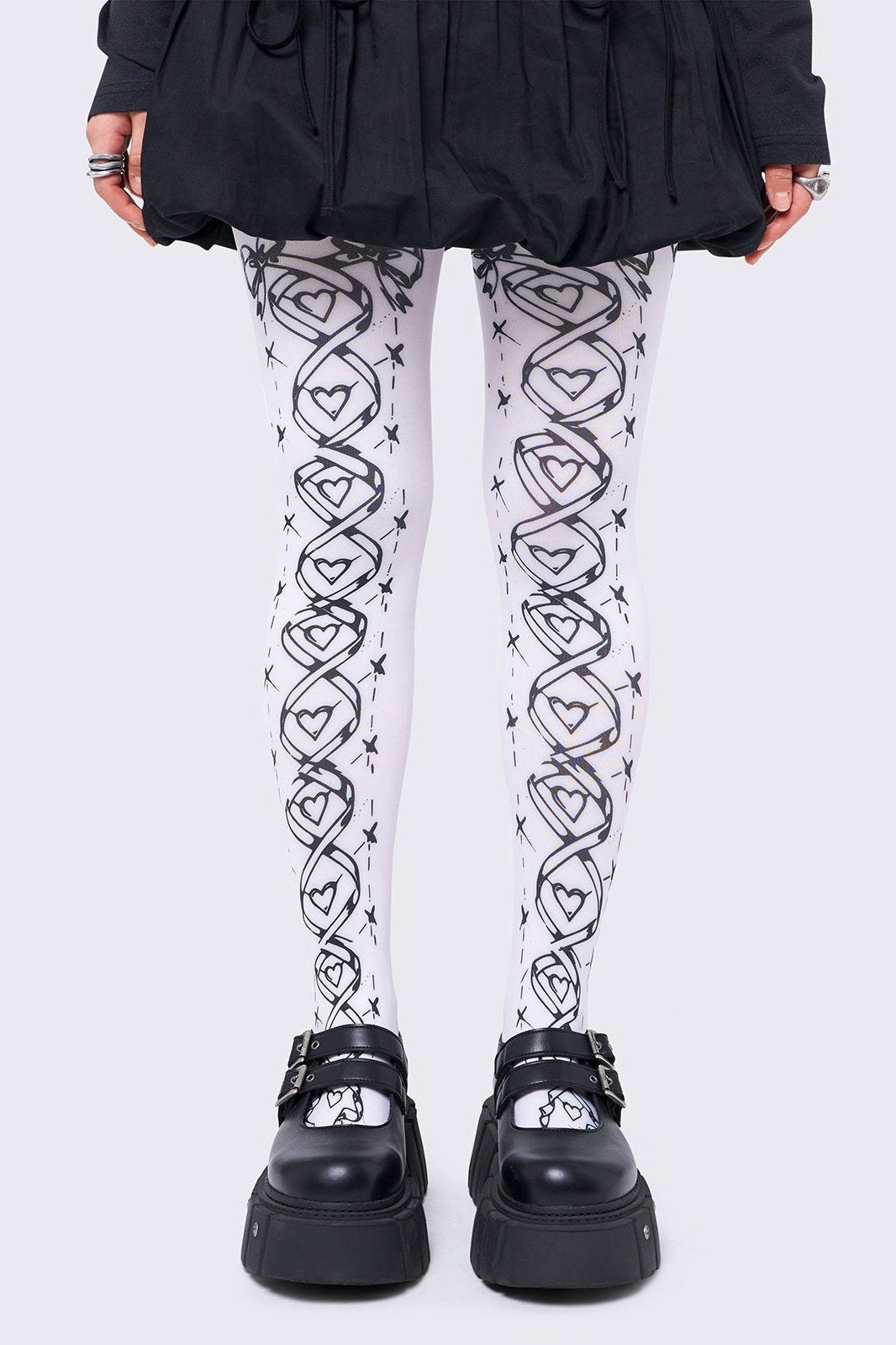 Opaque tights in white with black lace-up corset print.