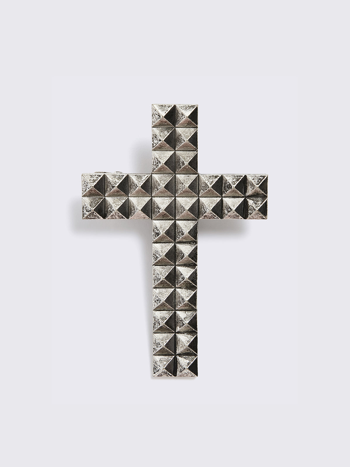 Silver crossed hair clip.
