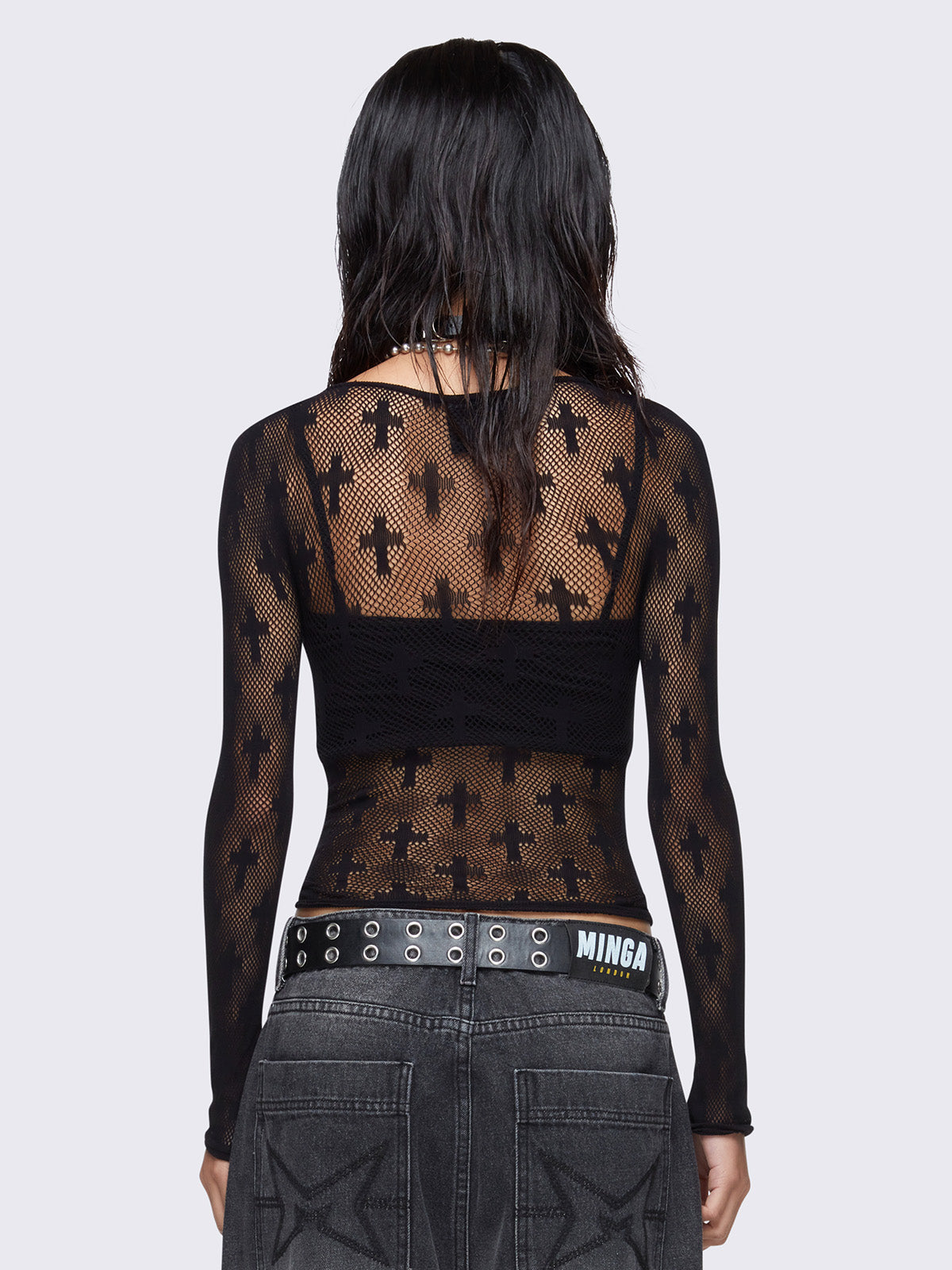 Black fishnet top with crosses design.