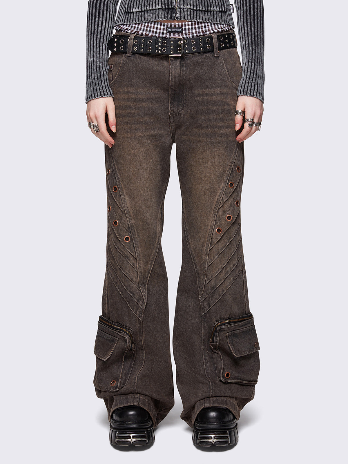 Grey washed flare baggy jeans with brown overdye, twist seam, eyelet details and utility ankle pockets.