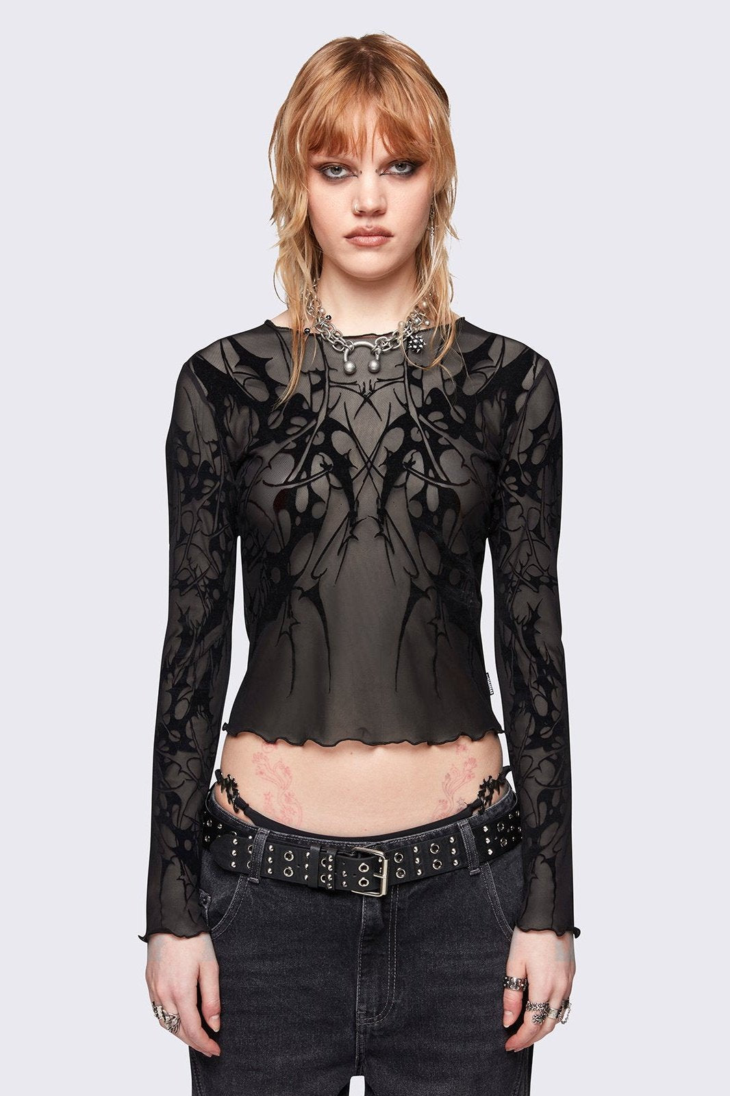 Grey mesh top with all over sigilism graphic flock print.