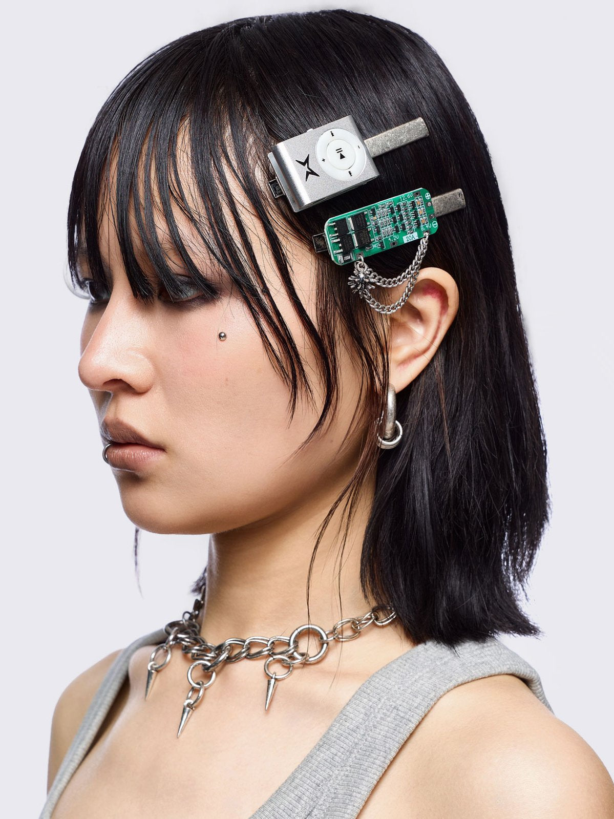 Set of 4 hair clips: Earbuds, keyboard, retro MP3 and circuit board designs.