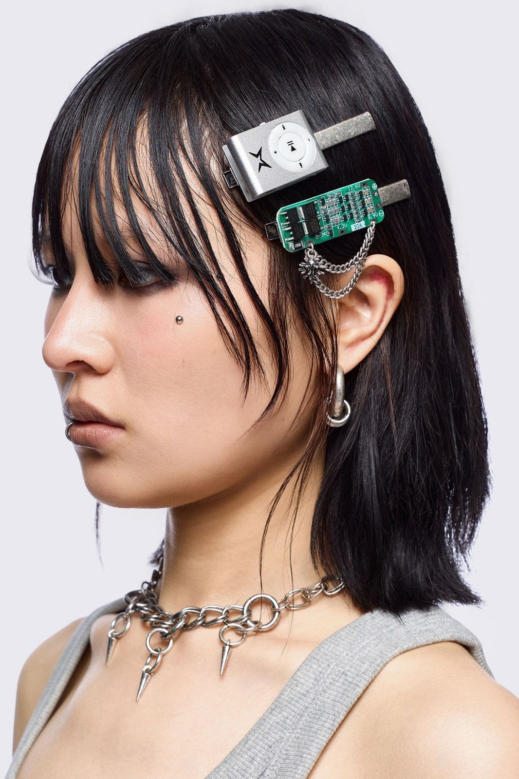 Set of 4 hair clips: Earbuds, keyboard, retro MP3 and circuit board designs.