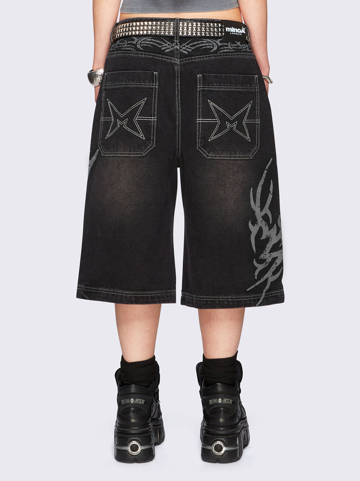 Black washed longline denim jorts with grey sigilism tattoo prints on side and back.