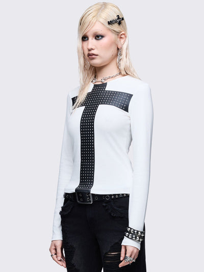 White long sleeve top with black chunky cross with silver studs