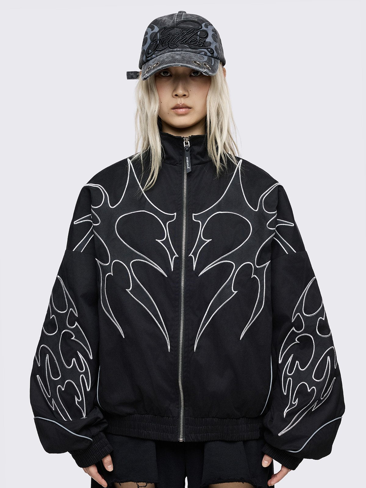 Black windbreaker jacket with white sigilism embroidery