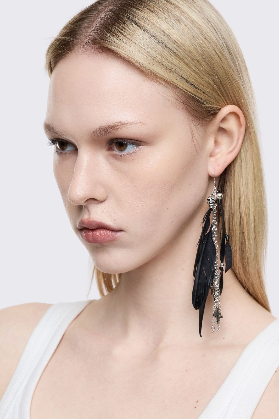 Silver 5pc earring set with black feathers, cross and gem pendants.
