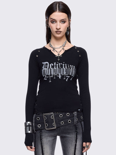 Black long sleeve top with "delirium" graphic front print, lace-up sides and silver eyelet details. 