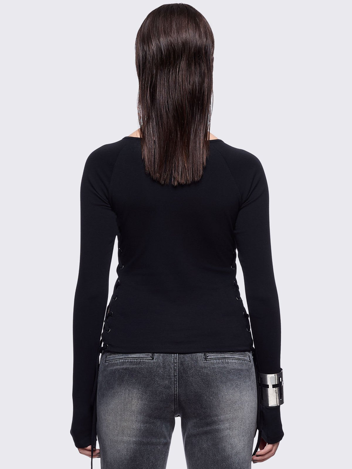 Black long sleeve top with "delirium" graphic front print, lace-up sides and silver eyelet details. 