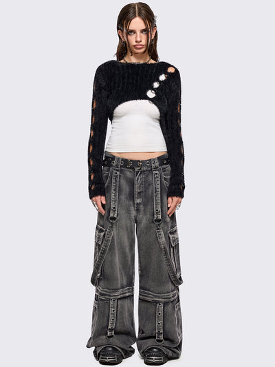 Black fuzzy knitted sweater with cut-outs with metal ring hardware details.
Bolero asymmetric style.