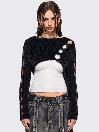 Black fuzzy knitted sweater with cut-outs with metal ring hardware details.
Bolero asymmetric style.