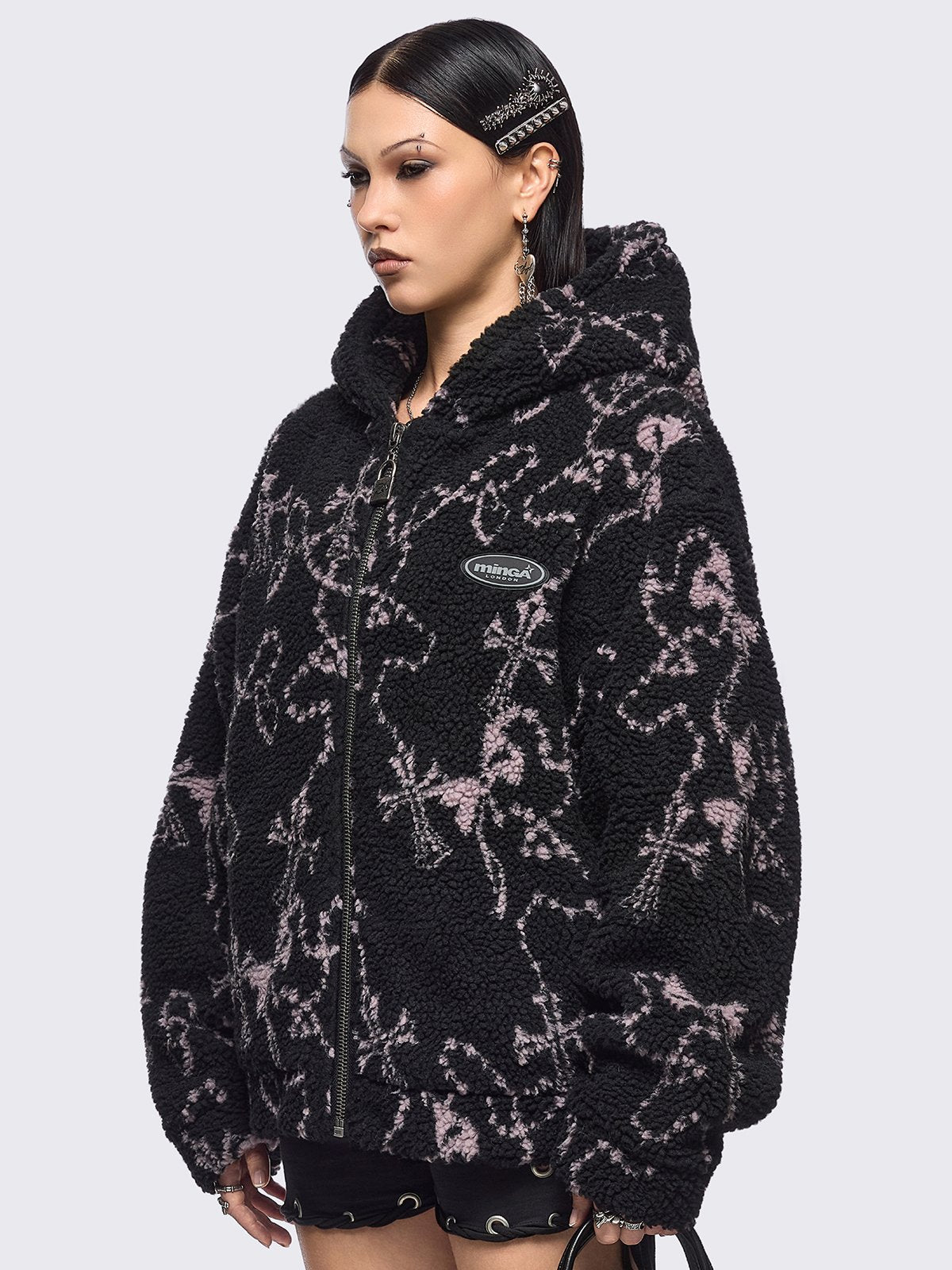 Black fleece borg hoodie jacket featuring all over pink rosary designs.