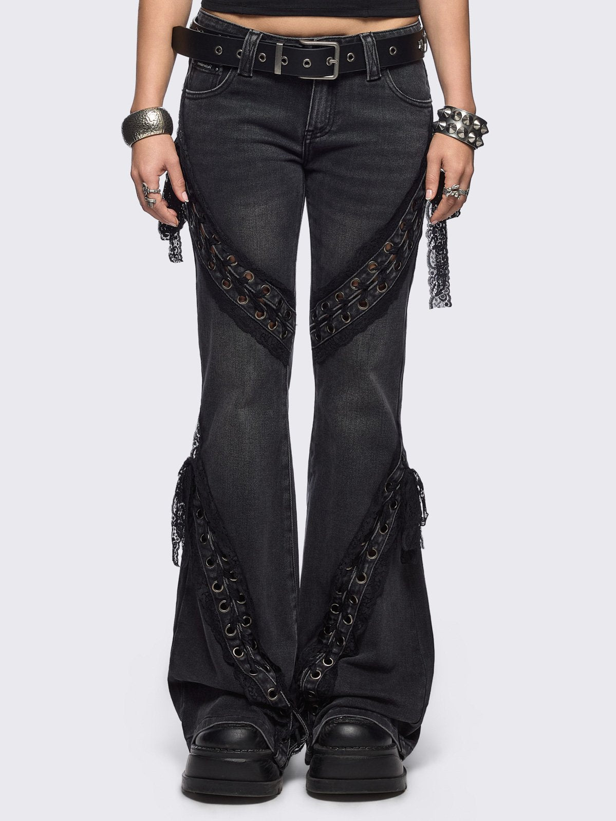 Black washed flare jeans with lace up bow details.