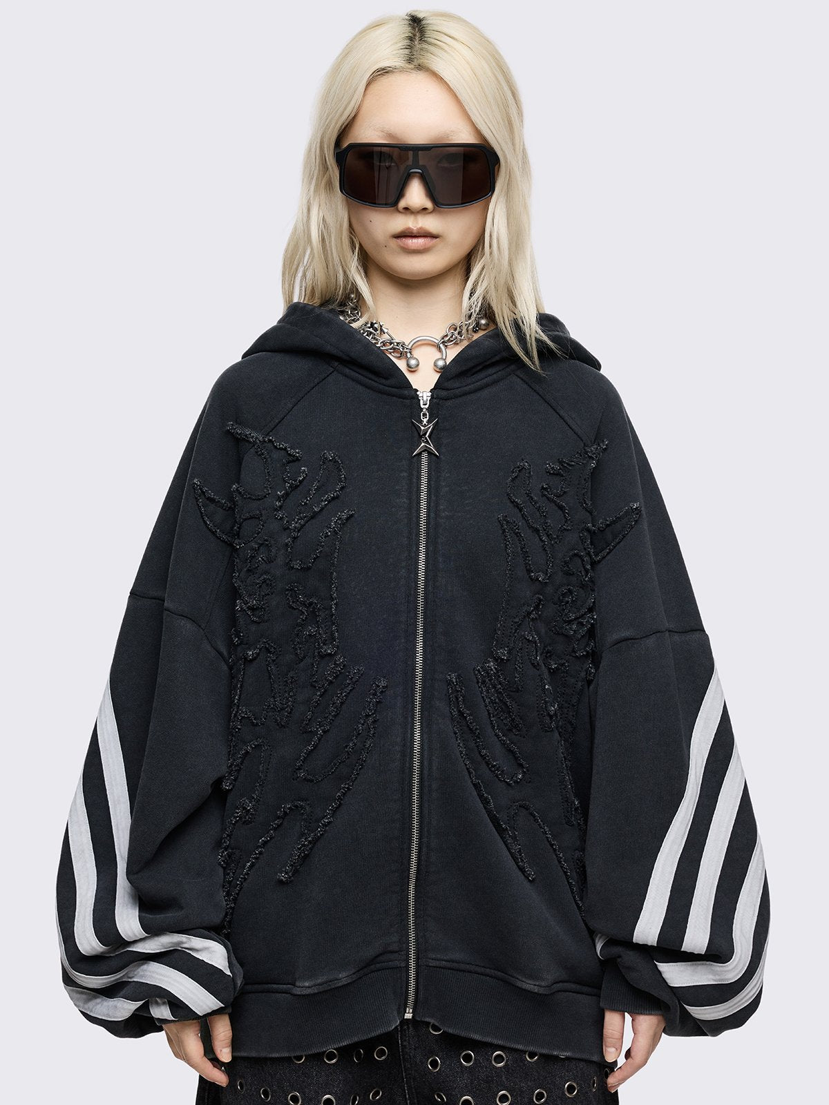 Black oversized zip up hoodie with white stripes and raw patch.