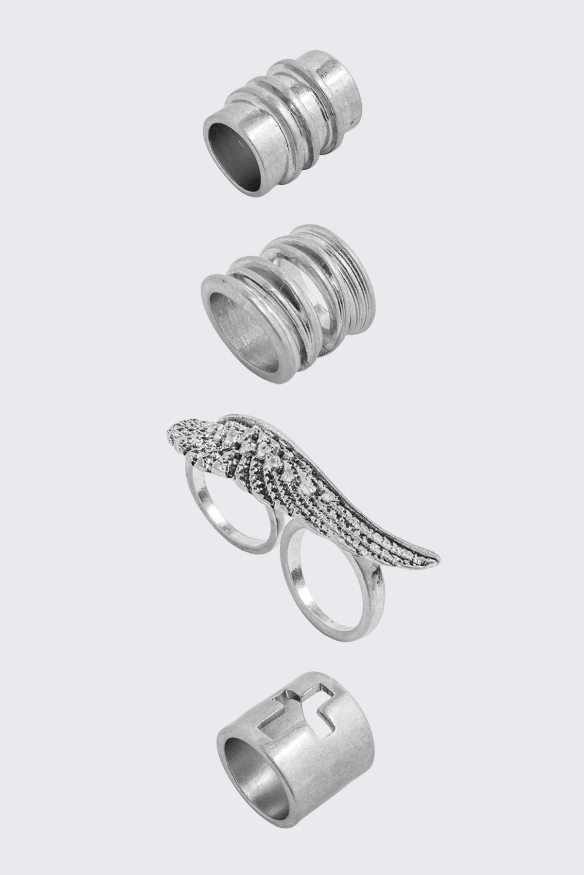 Set of 4 silver rings with wing and cross designs