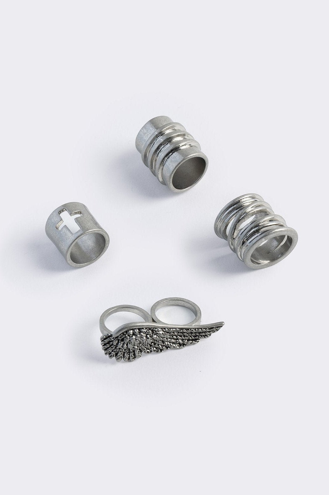Set of 4 silver rings with wing and cross designs
