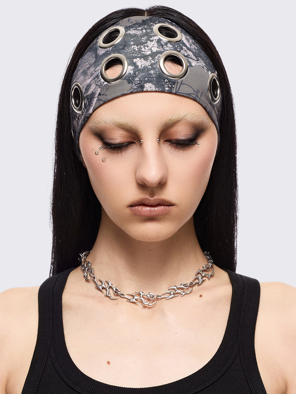Forest tree camo print headband with eyelets metallic hole details.