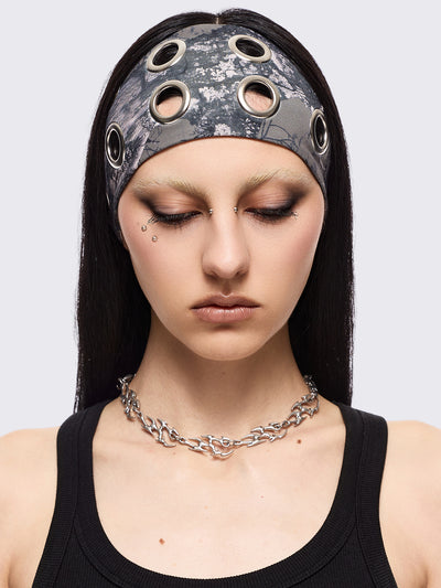 Forest tree camo print headband with eyelets metallic hole details.