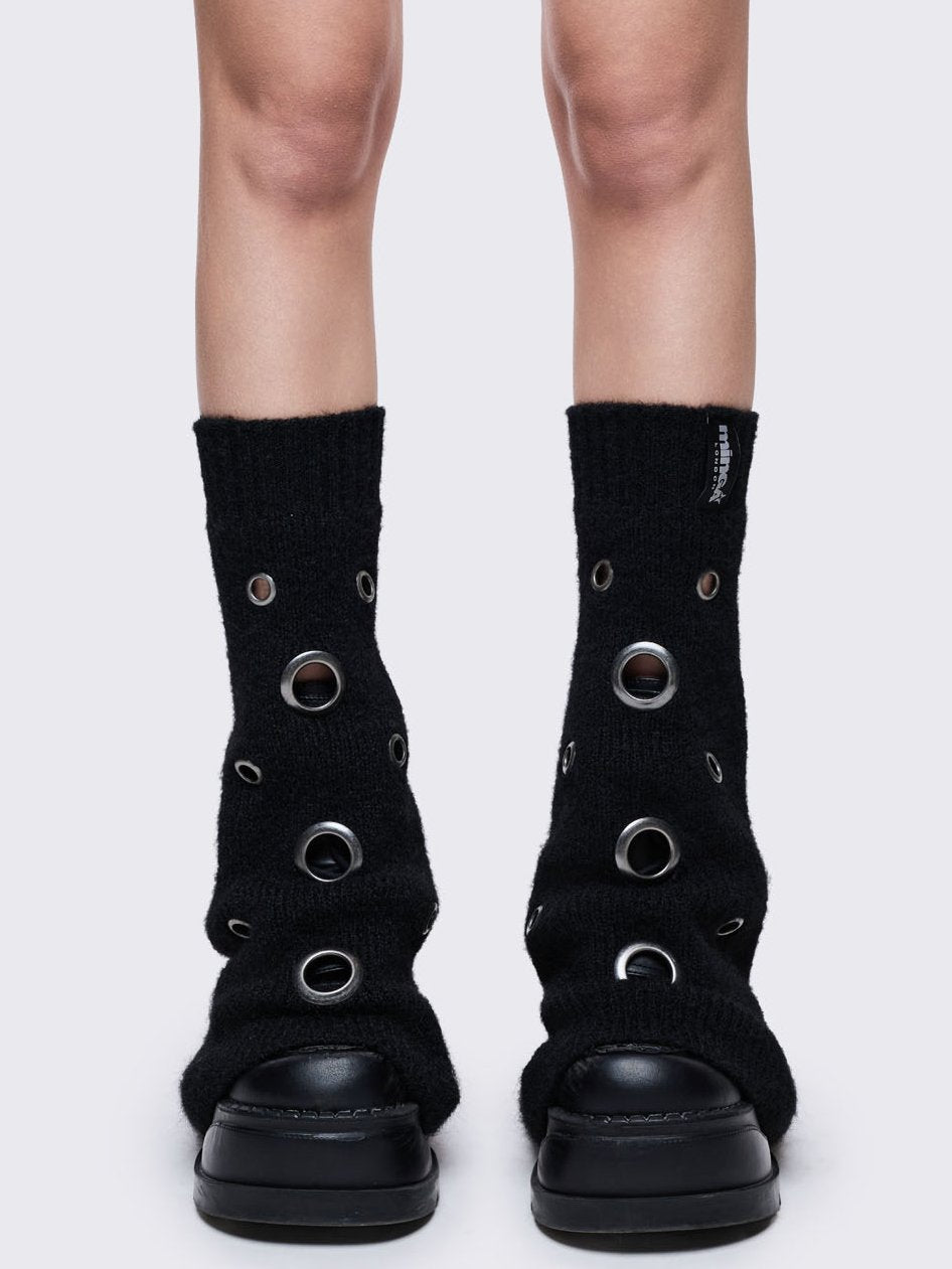 Black knitted flare leg warmers with chunky silver eyelets