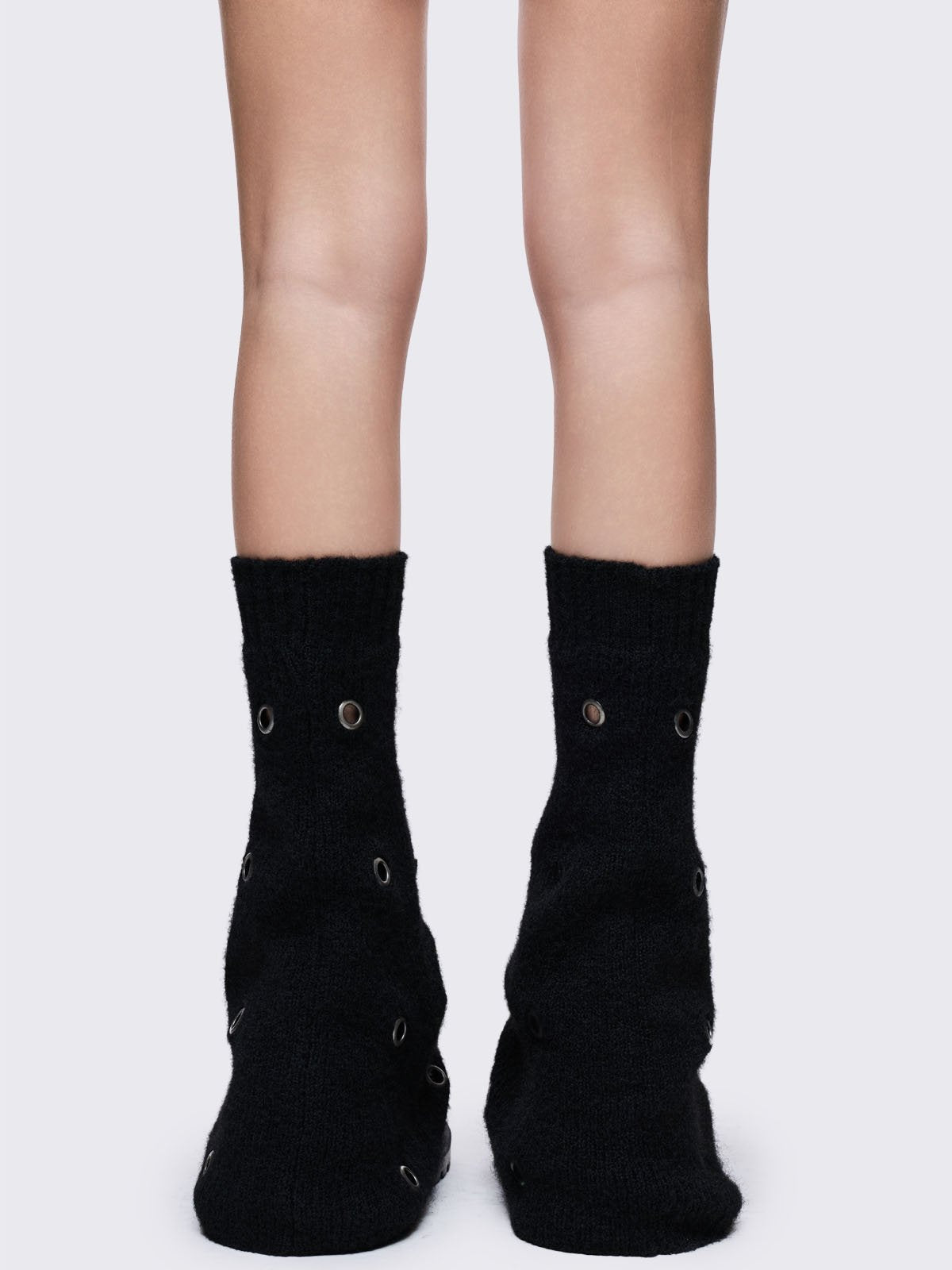 Black knitted flare leg warmers with chunky silver eyelets