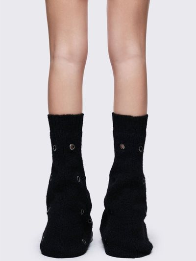 Black knitted flare leg warmers with chunky silver eyelets