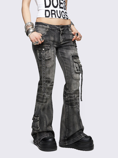 Black washed cargo flared jeans with utility pockets and straps.