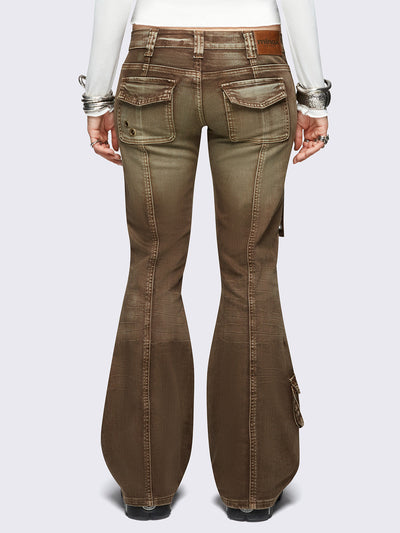 Brown washed cargo flared jeans with utility pockets and straps.