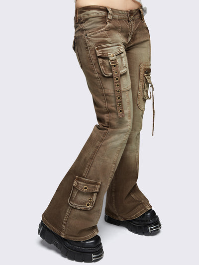 Brown washed cargo flared jeans with utility pockets and straps.