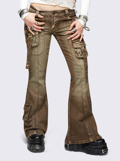 Brown washed cargo flared jeans with utility pockets and straps.