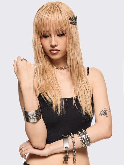 Set of 4 bracelets featuring spike, chain, locker and piercing details.