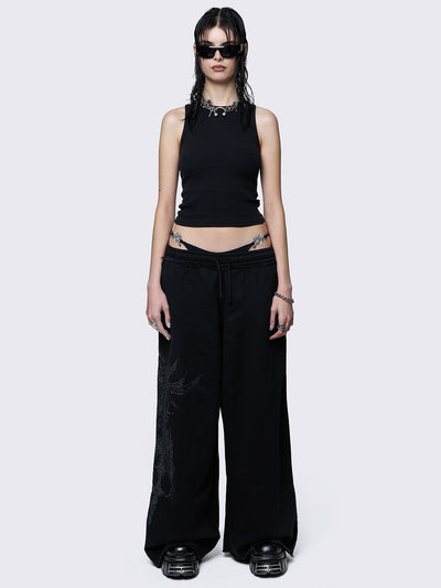 Wide leg joggers in black with grunge graphic side print.