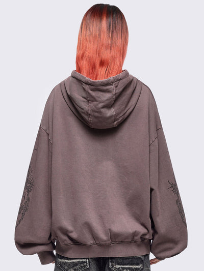 Washed brown zip-up hoodie jacket with grunge graphic prints on the front and sleeves.