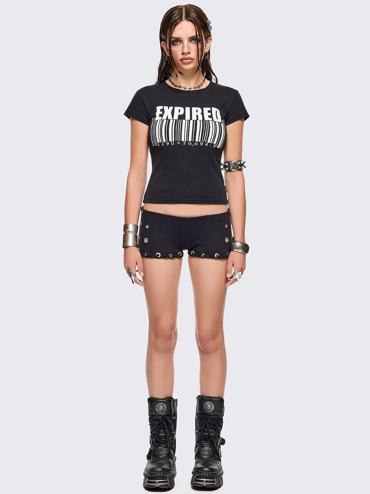 Black graphic baby tee with "expired" barcode graphic print in white.
