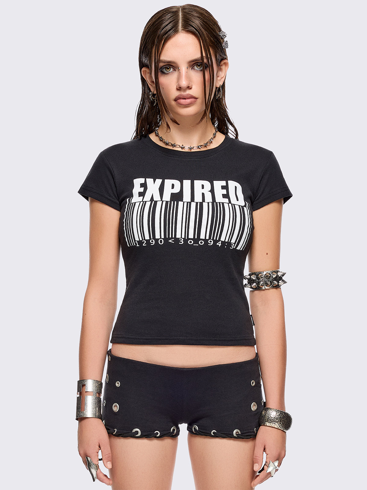 Black graphic baby tee with "expired" barcode graphic print in white.