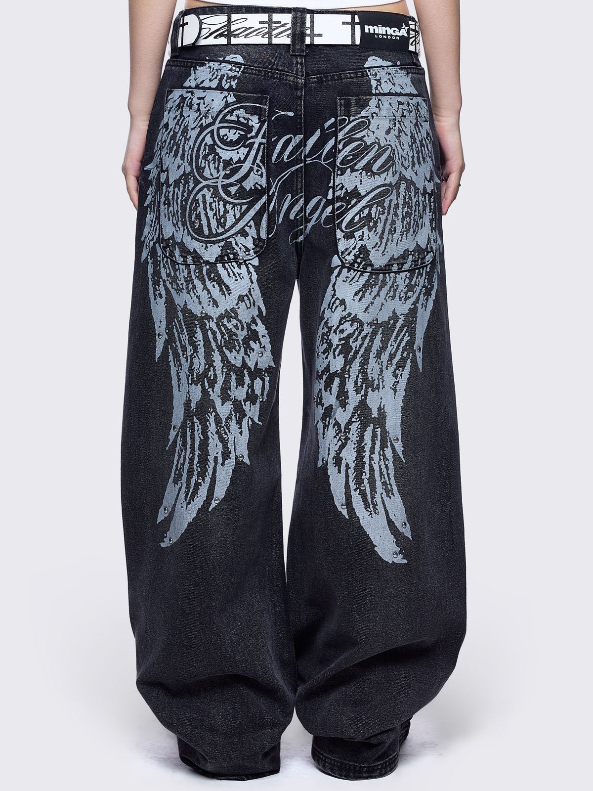 Black washed baggy jeans featuring a "Fallen Angel" winged graphic back print.