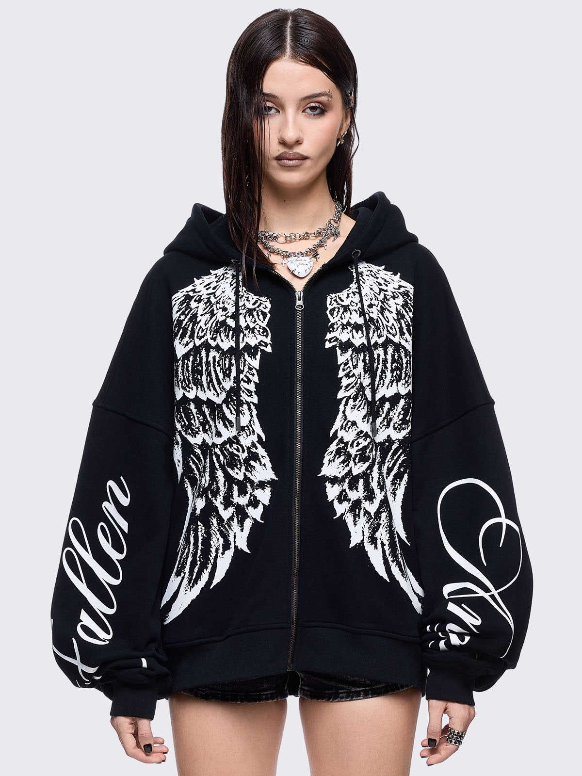 Black zip up hoodie jacket featuring a white wings graphic front print and "fallen angel" on sleeves